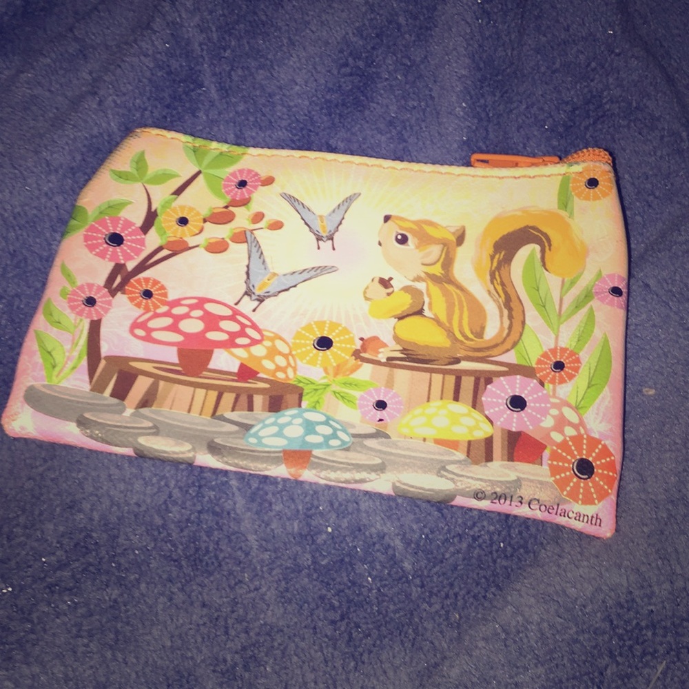 I’m selling this little coin bag with a squirrel